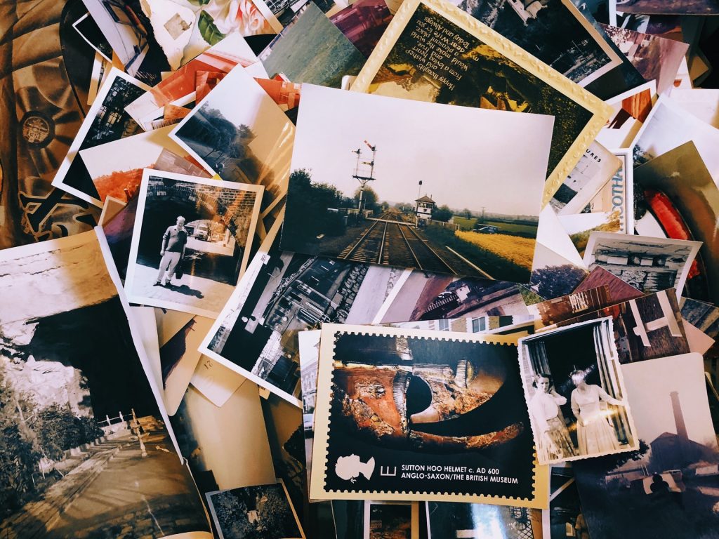 A scattered stack of photographs offers ideas for a website. Photo by Jon Tyson
