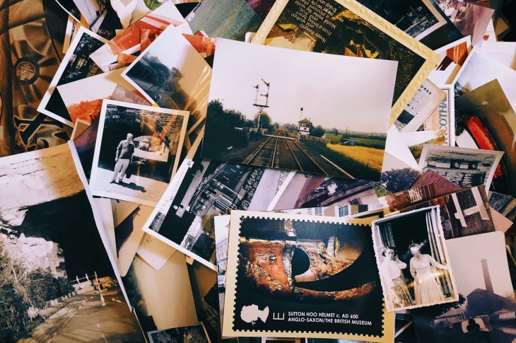 A scattered stack of photographs offers ideas for a website. Photo by Jon Tyson